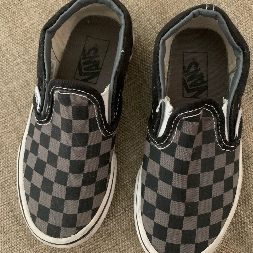 Kids slip on black and grey checkered Vans